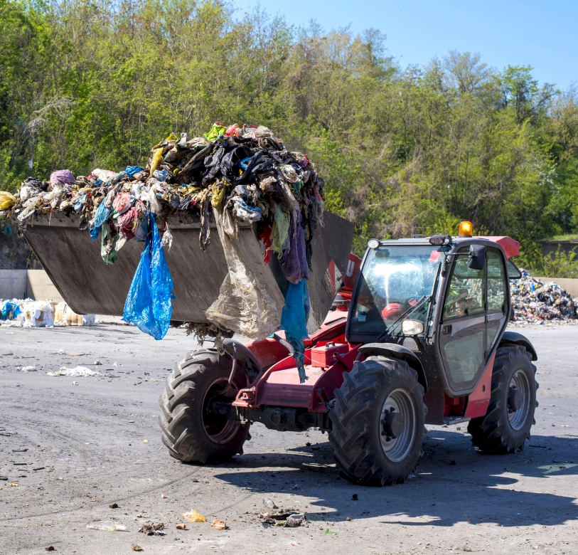 wheel loader transporting municipal waste waste treatment plant